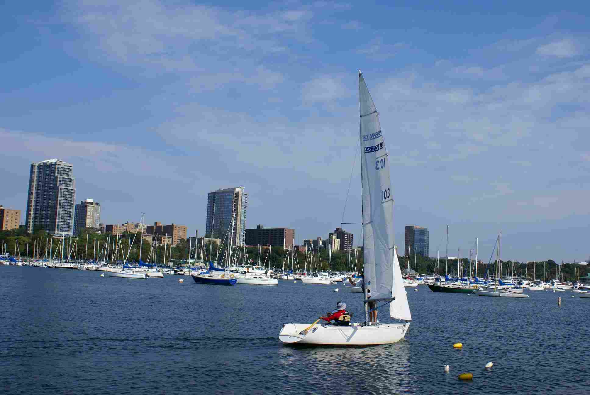 Race Sailboat with Milwaukee marina in background